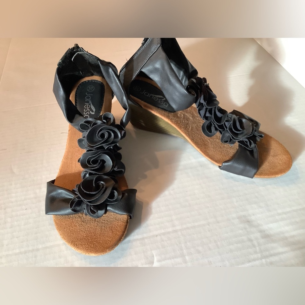 Janessa black open toe low wedge sandals, faux-leather floral design.